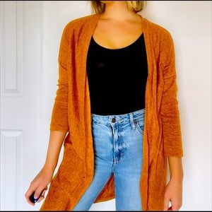 Gold knee length sweater